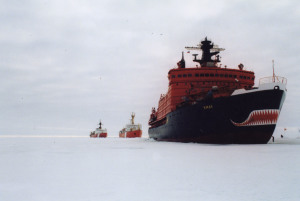 A Russian icebreaker clears a path for two Canadian Coast Guard ships.