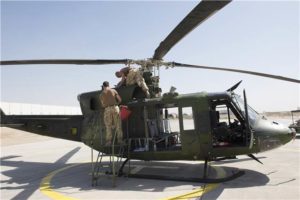 Canadian Armed Forces personnel from 430 Tactical Helicopter Squadron assemble and conduct start up checks on a CH-146 Griffon helicopter in Erbil, Iraq during Operation IMPACT on October 5, 2016. Photo: Op Impact, DND  KW05-2016-0168-006