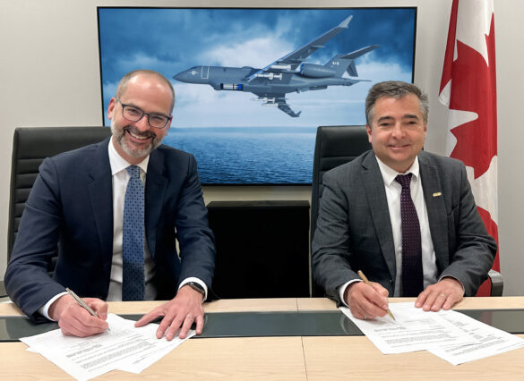 Jean-Christophe Gallagher (left), Executive Vice-President, Aircraft Sales and Bombardier Defense, and Joel Houde, Vice President and General Manager, General Dynamics Mission Systems–International, signing a Memorandum of Understanding