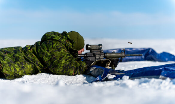 An Arctic Response Company Group member fires a C8A3 Carbine Rifle outside of Rankin Inlet during Operation NANOOK-NUNALIVUT on March 13, 2023.