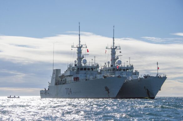 Her Majesty's Canadian Ship (HMCS) SHAWINIGAN (left) and HMCS MONCTON (right) both Kingston-class Maritime Coastal Defence Vessels (MCDVs) perform a fuel transfer while at anchor off Rankin Inlet, Nunavut on August 25, 2016 in support of Operation NANOOK.