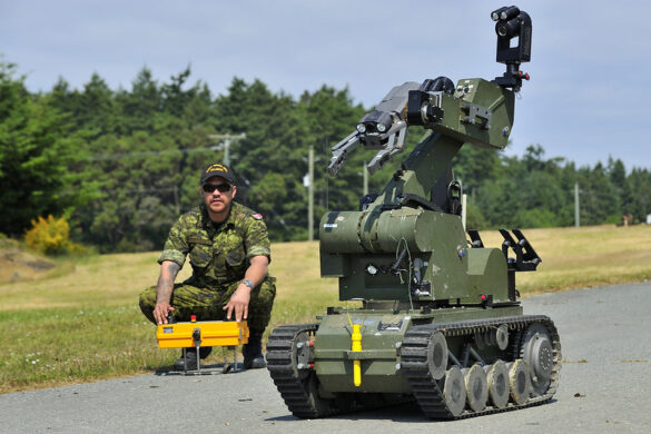 A member of a Canadian Explosive Ordnance Disposal Team operates a bomb disposal robot to be used in the controlled detonation of an Improvised Explosive Device (IED) during Exercise ARDENT DEFENDER at Rocky Point Demolition Range, Canadian Forces Base (CFB) Esquimalt on May 27, 2015 Photo: LS Zachariah Stopa, MARPAC Imaging Services ET2015-0193-02