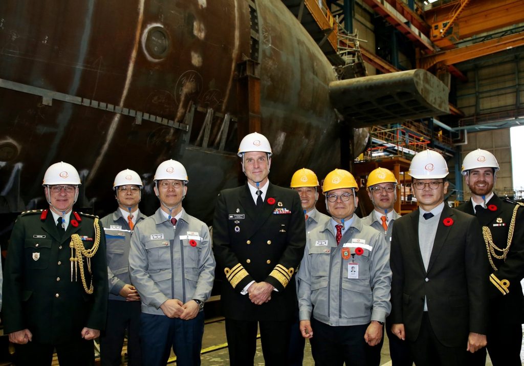 Angus Topshe (fourth from left), Commander of the Royal Canadian Navy, visits Hanwha Ocean's Geoje Shipyard and takes a tour of the submarine construction site. Hanwha Ocean picture. Image source: https://www.navalnews.com/naval-news/2024/11/hanwha-ocean-welcomes-the-commander-of-the-royal-canadian-navy/