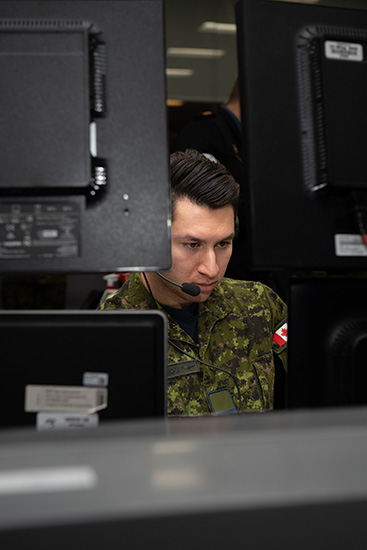 Captain Aris Papanicolaou executes air battle management at 22 Wing North Bay on January 25, 2024.

Photo by Master Corporal Jim Saunders, 22 Wing Imagery NCM